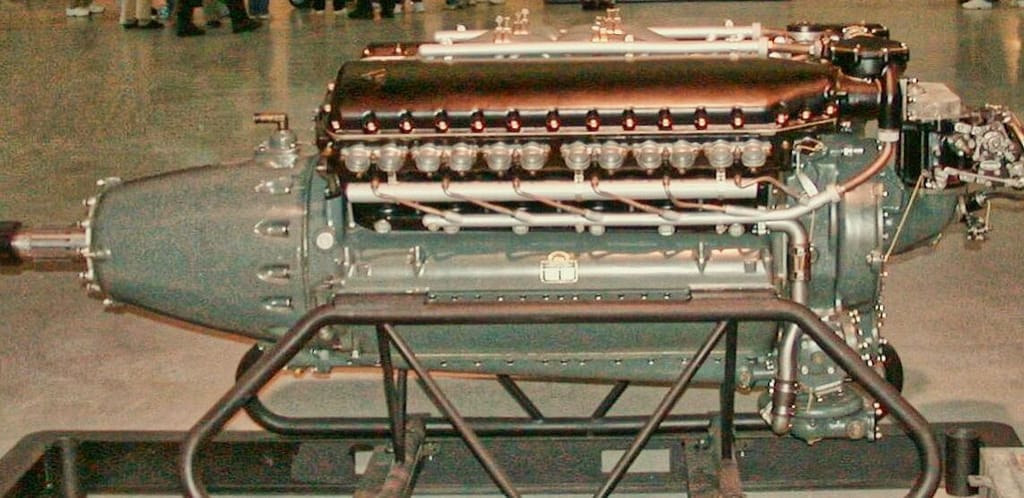 Vintage v12 aircraft engine on display with exposed components, featured in the Family-Friendly Guide to the Smithsonian.