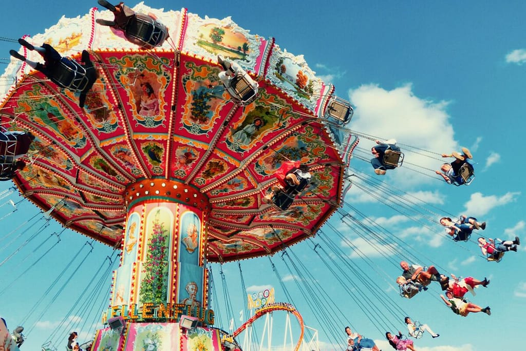 People are riding a carousel.