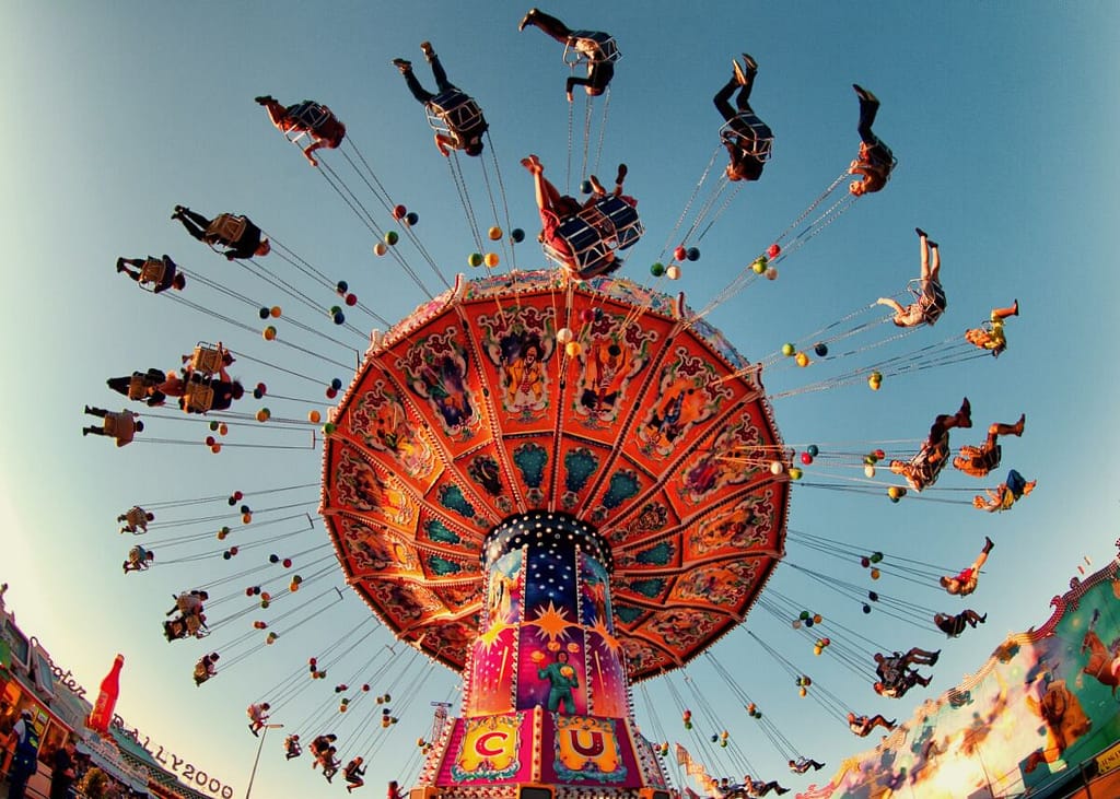 An amusement ride with people riding on it.